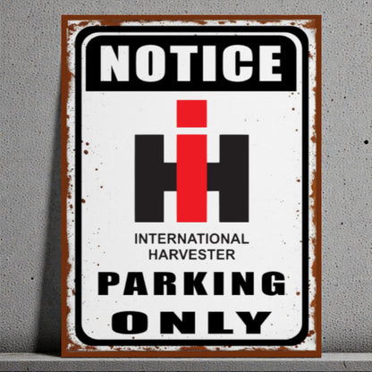 Vintage-style metal sign with 'Notice International Harvester Parking Only' text on a gray background