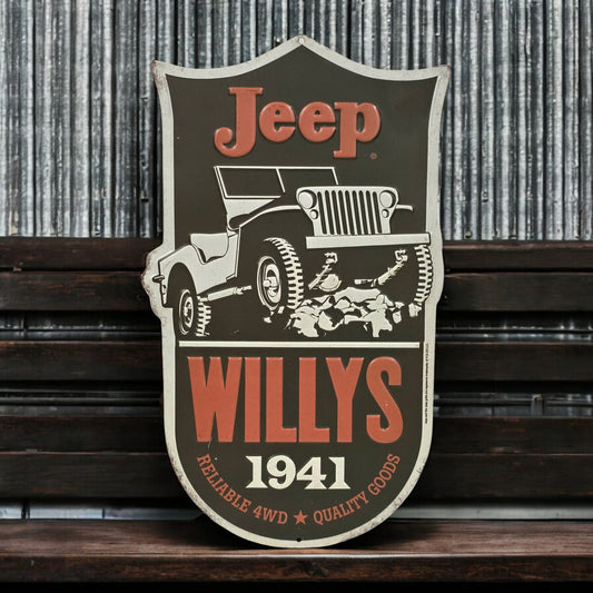 Decorative sign with Jeep Willys logo on a wooden surface