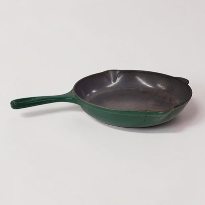 Vintage green Le Creuset No. 23 cast iron frying pan made in France.
