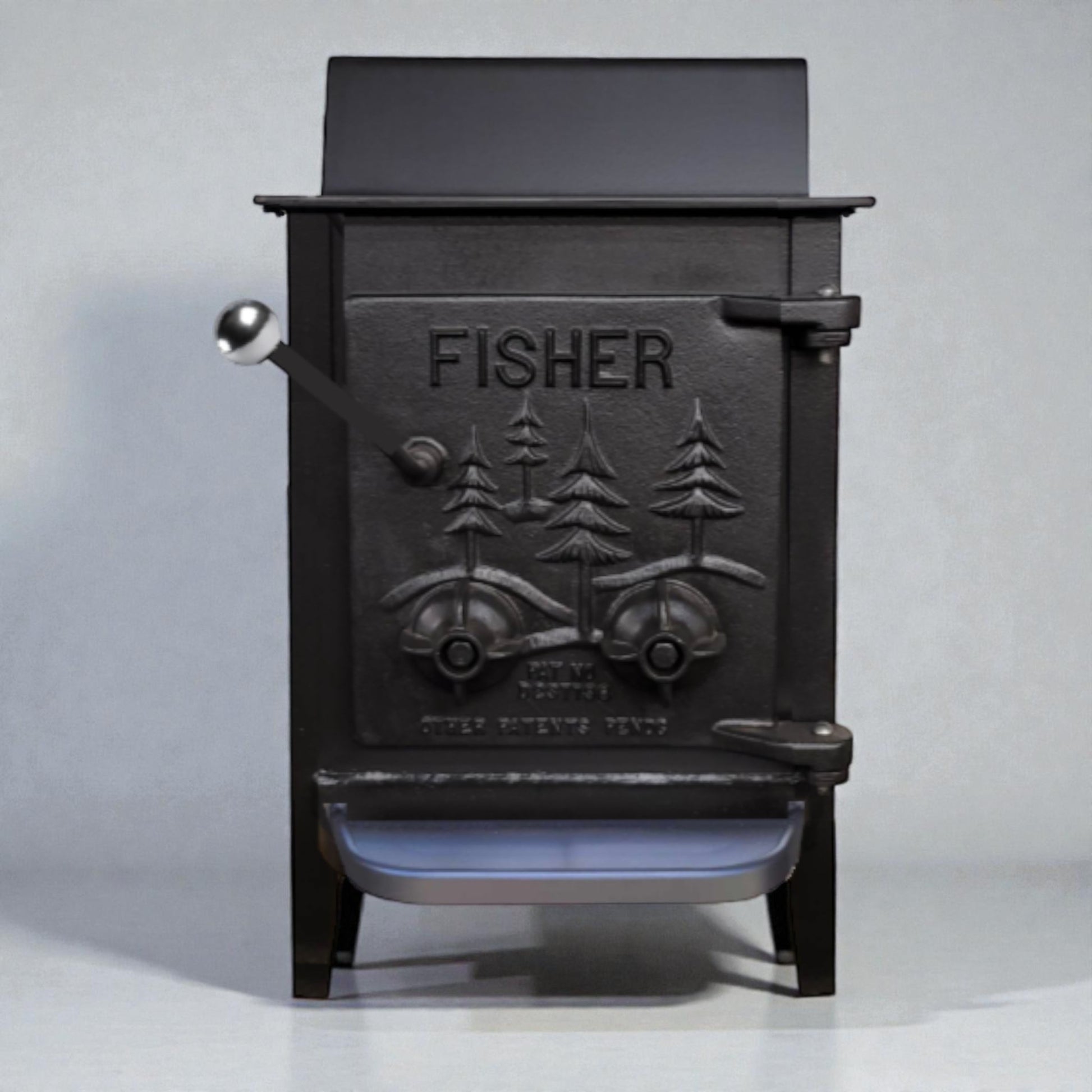 Black cast iron wood stove with 'Fisher' branding on a gray background