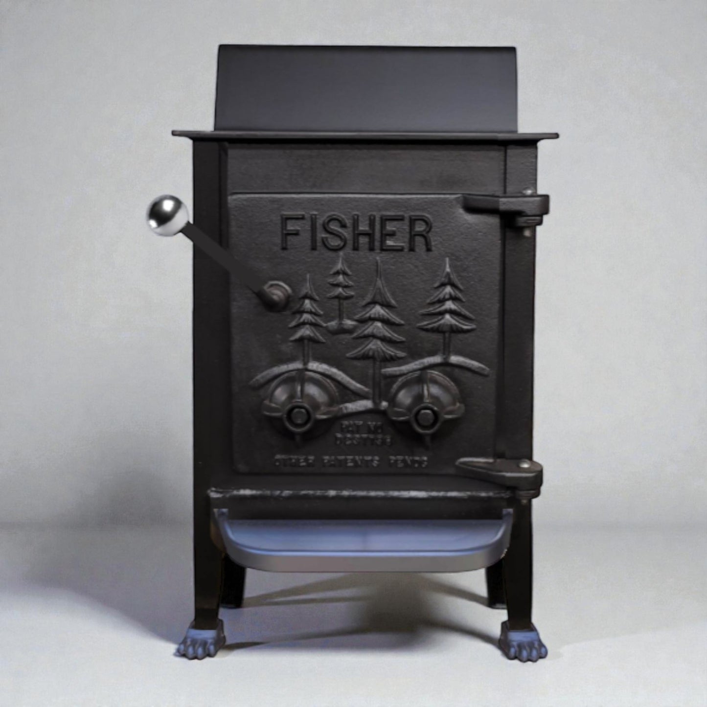 Black cast iron stove with 'Fisher' branding on a white background