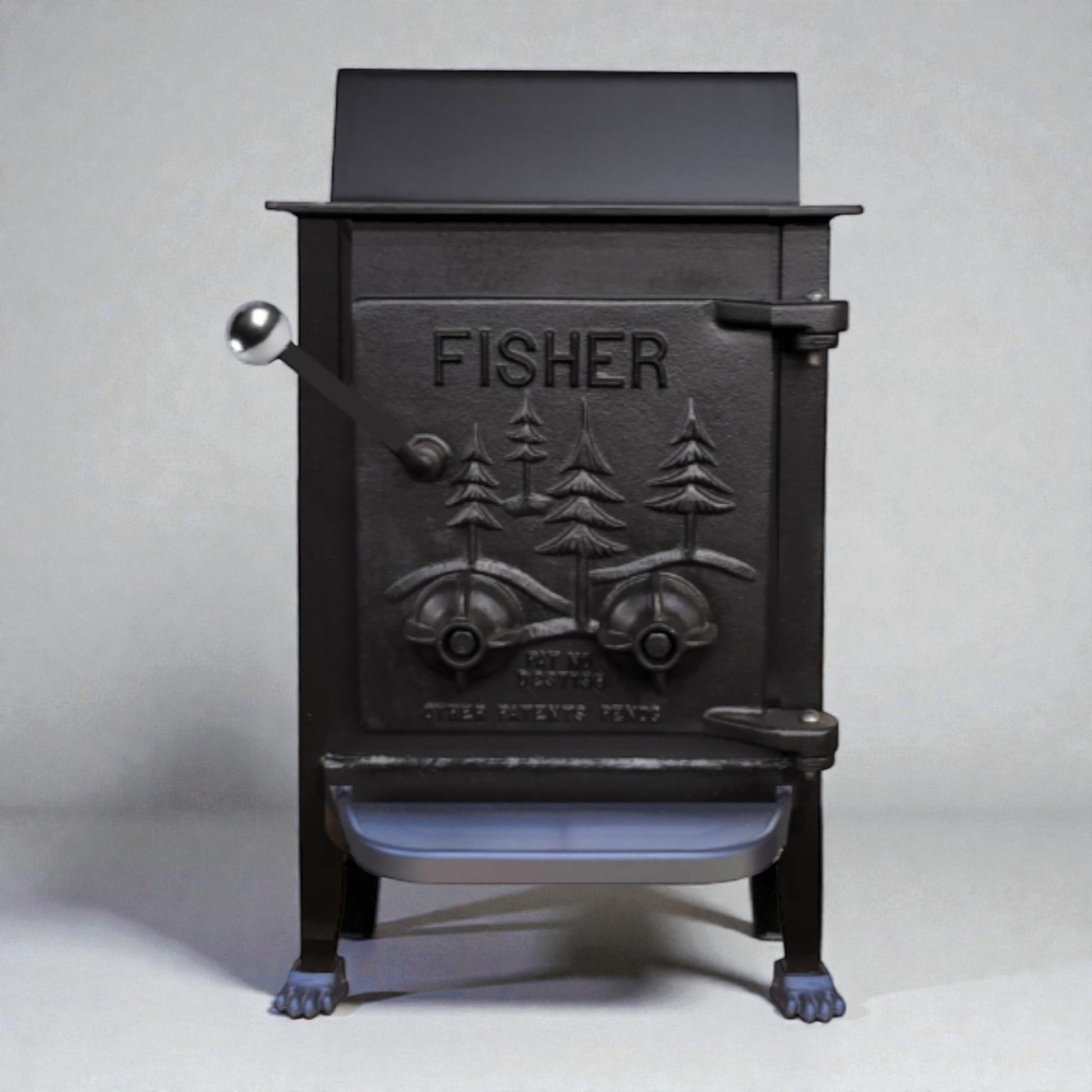 Black cast iron stove with 'Fisher' branding on a white background
