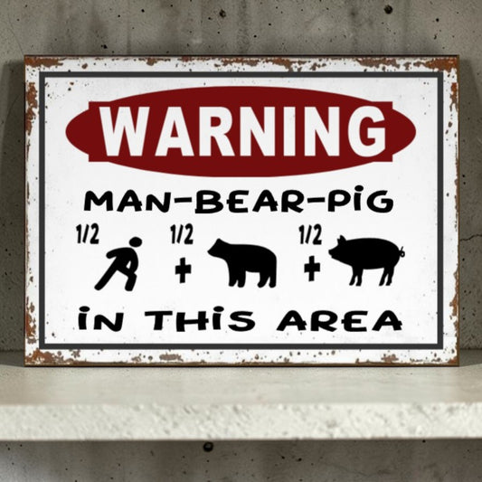 Vintage-style metal sign with humorous 'Man-Bear-Pig' graphic and warning text on a concrete wall.