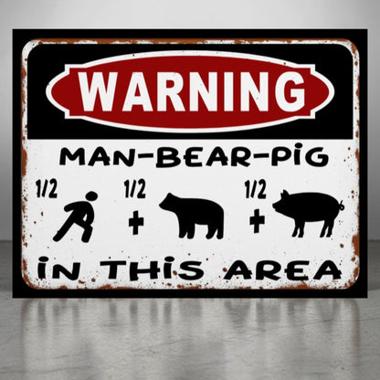 Vintage-style metal sign with a humorous warning about 'man-bear-pig' in a rustic frame.