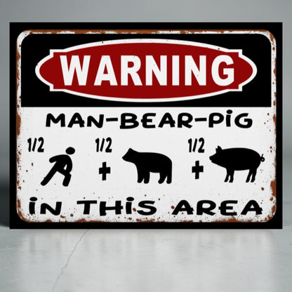 Metal sign with 'WARNING: MAN-BEAR-PIG IN THIS AREA' text and symbols on a gray background