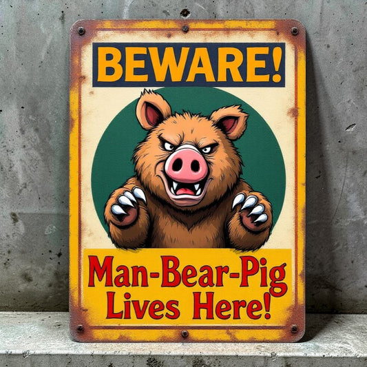 Vintage-style sign with cartoon bear and text 'Beware! Man-Bear-Pig Lives Here!' on a textured wall background.