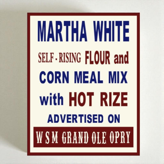 Vintage-style advertisement sign for Martha White flour and corn meal mix with hot rize on a white background.