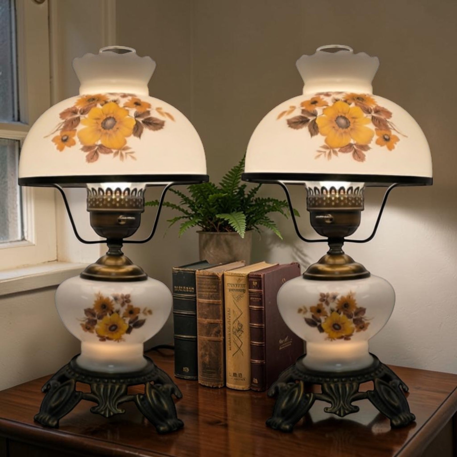 Pair of vintage Gone with the Wind lamps with floral glass and dual lighting.