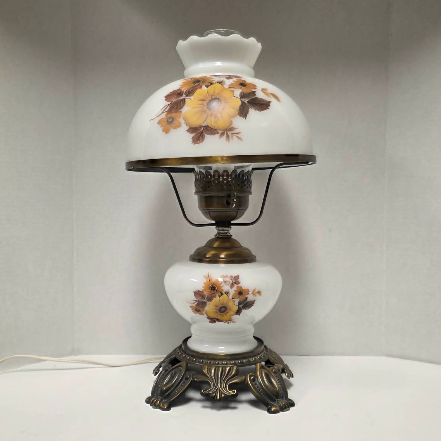 Pair of vintage Gone with the Wind lamps with floral glass and dual lighting.