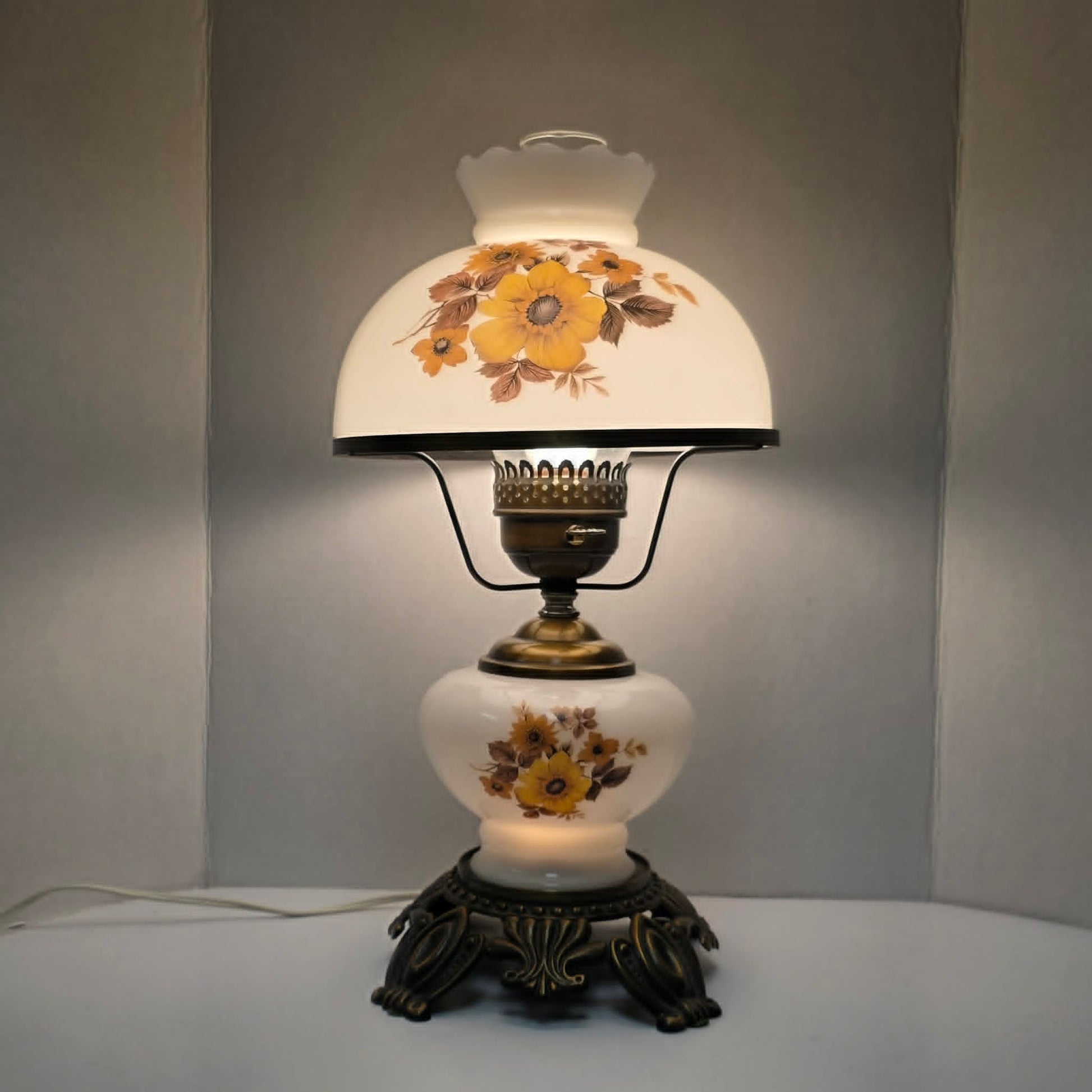 Pair of vintage Gone with the Wind lamps with floral glass and dual lighting.