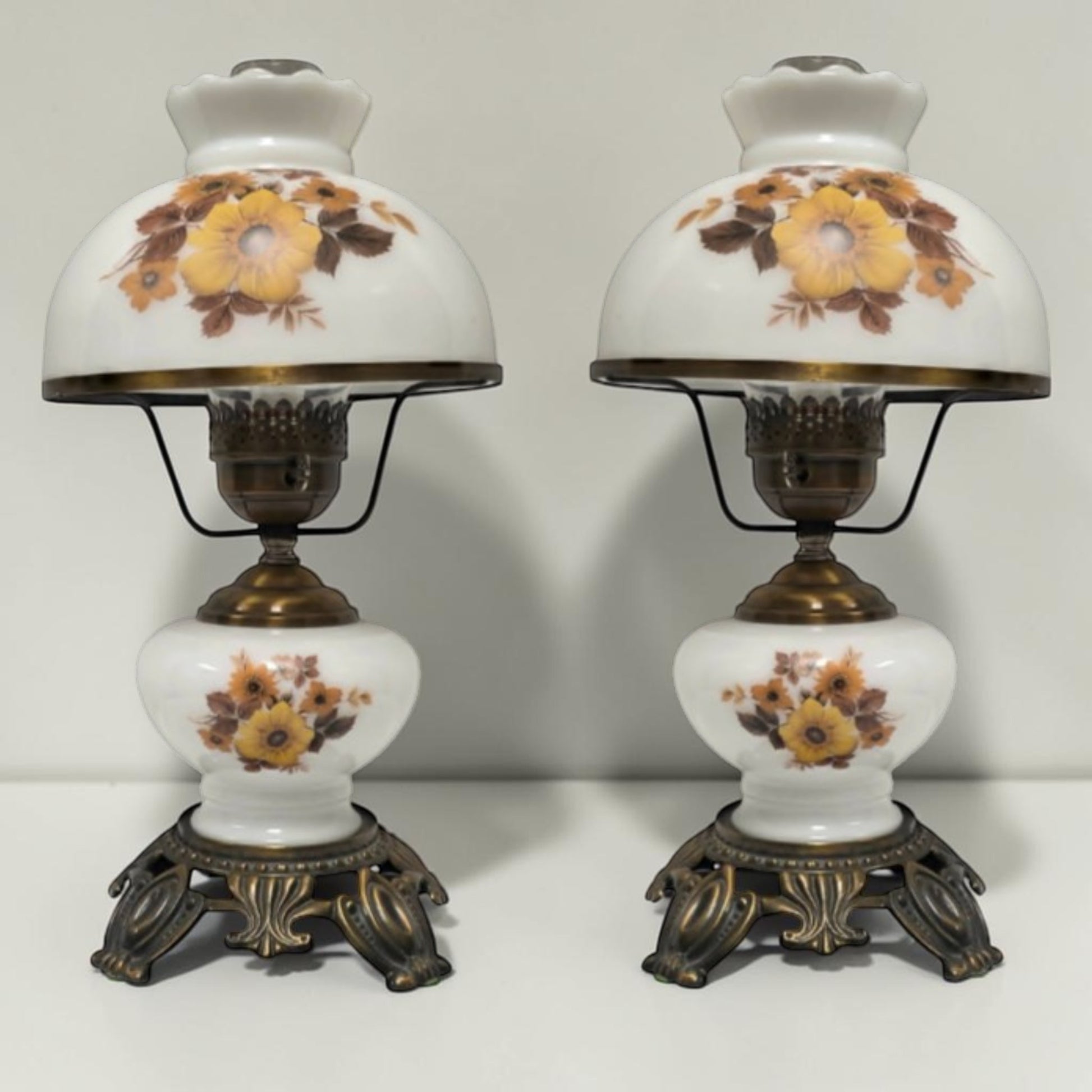 Pair of vintage Gone with the Wind lamps with floral glass and dual lighting.