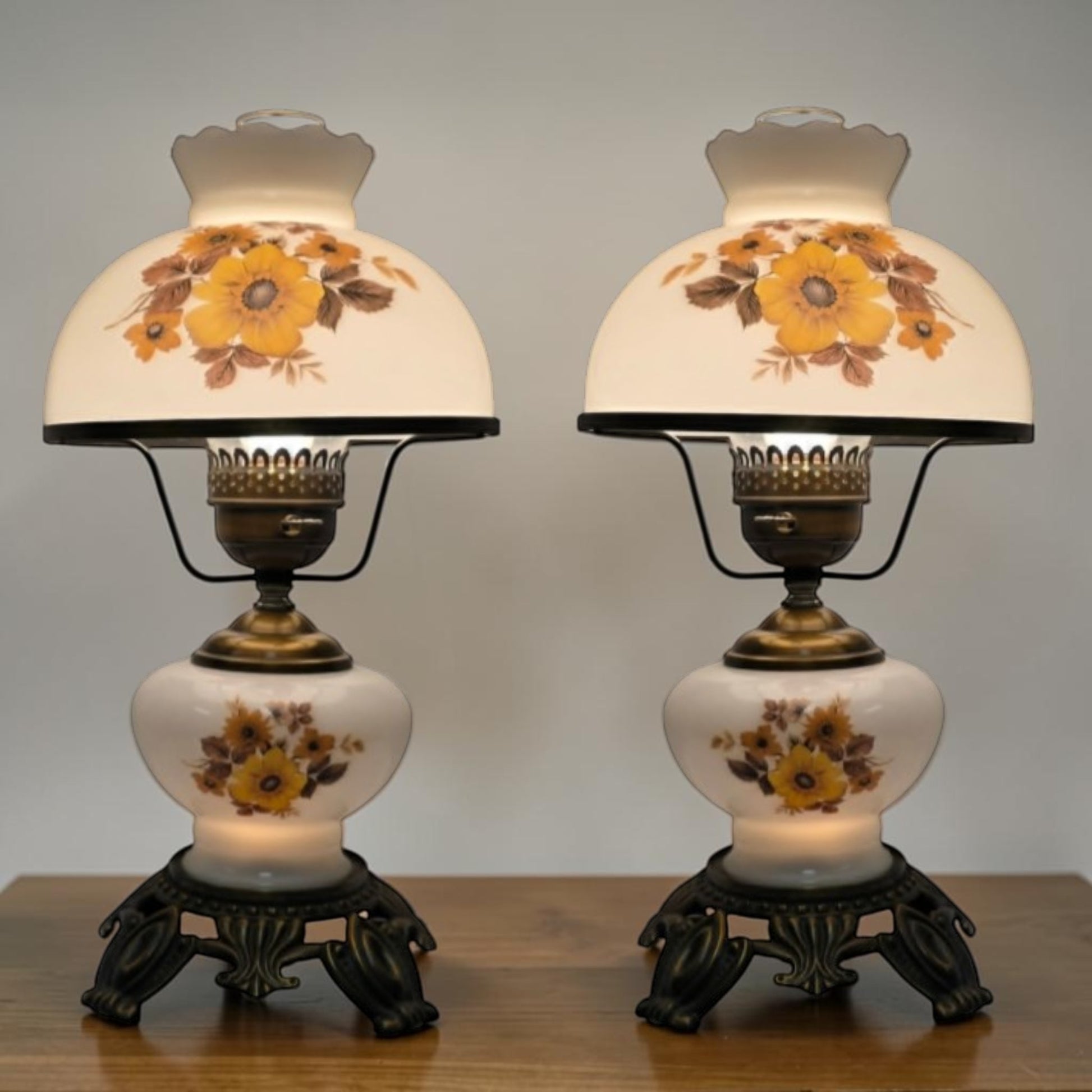 Pair of vintage Gone with the Wind lamps with floral glass and dual lighting.