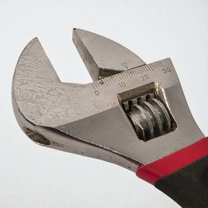 Adjustable wrench with measurement scale on a white background