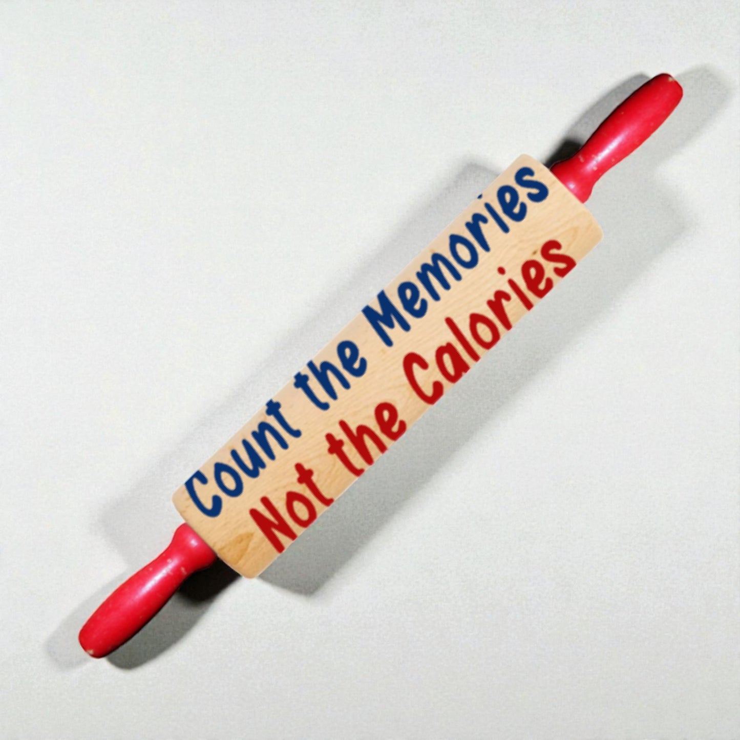 Rolling pin with a motivational message on a white background