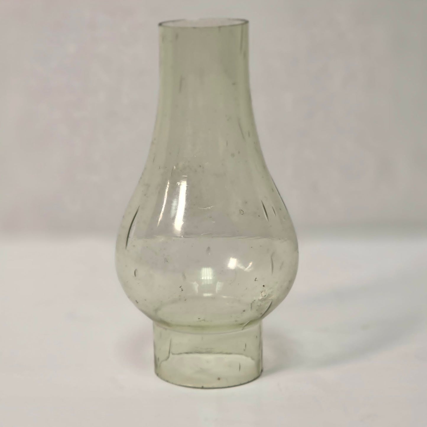 Antique miniature lamp chimney with primitive bubble glass inclusions.