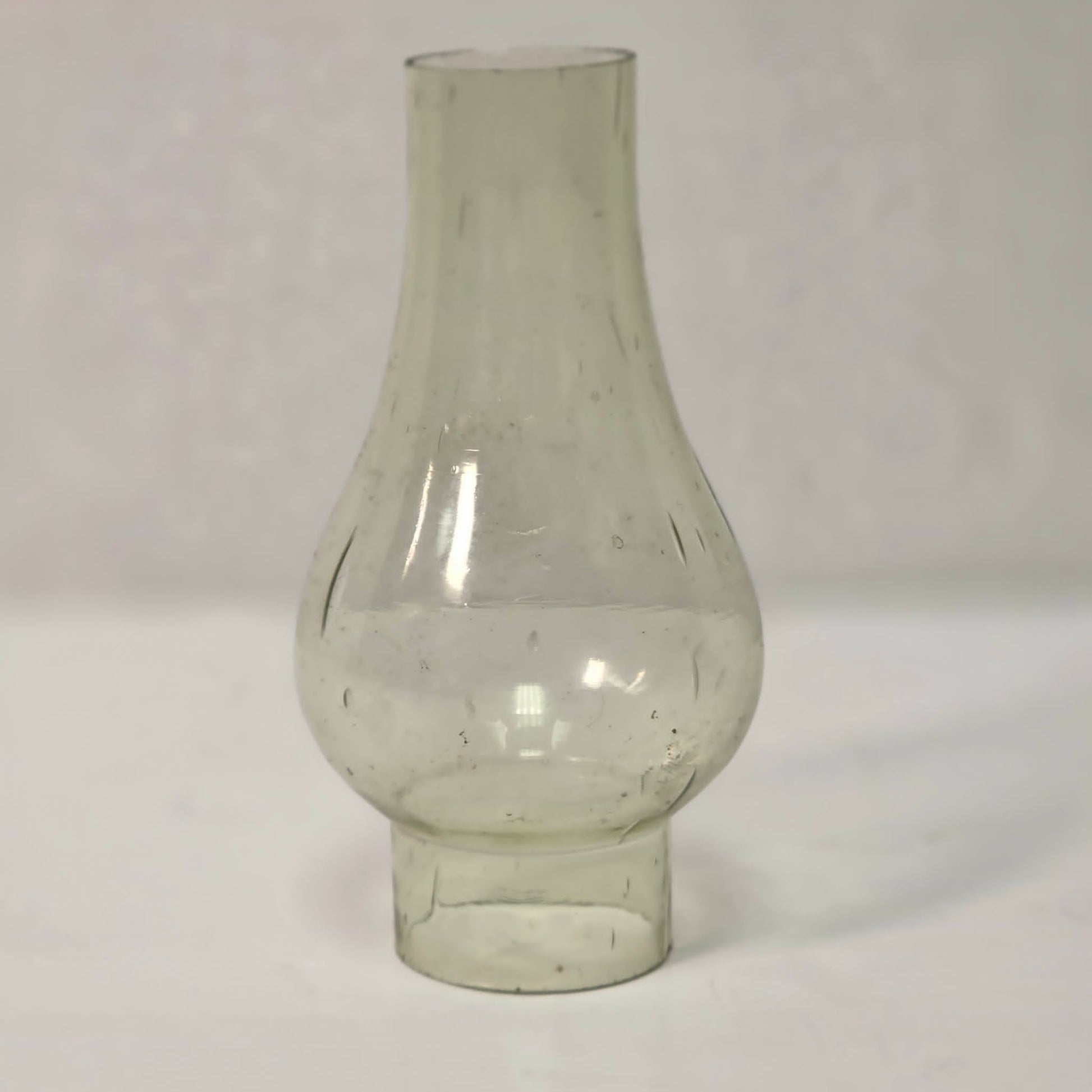 Antique miniature lamp chimney with primitive bubble glass inclusions.