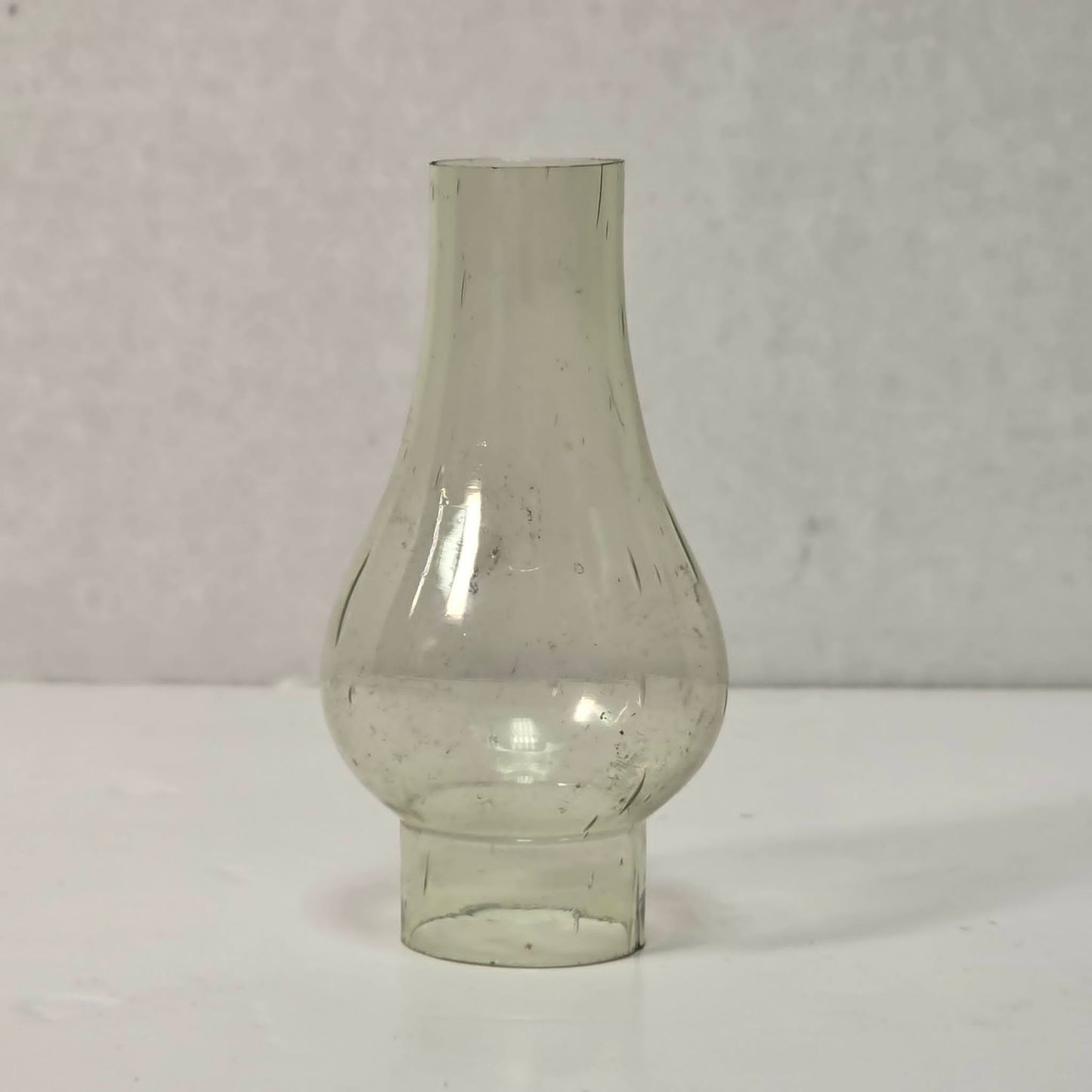 Antique miniature lamp chimney with primitive bubble glass inclusions.
