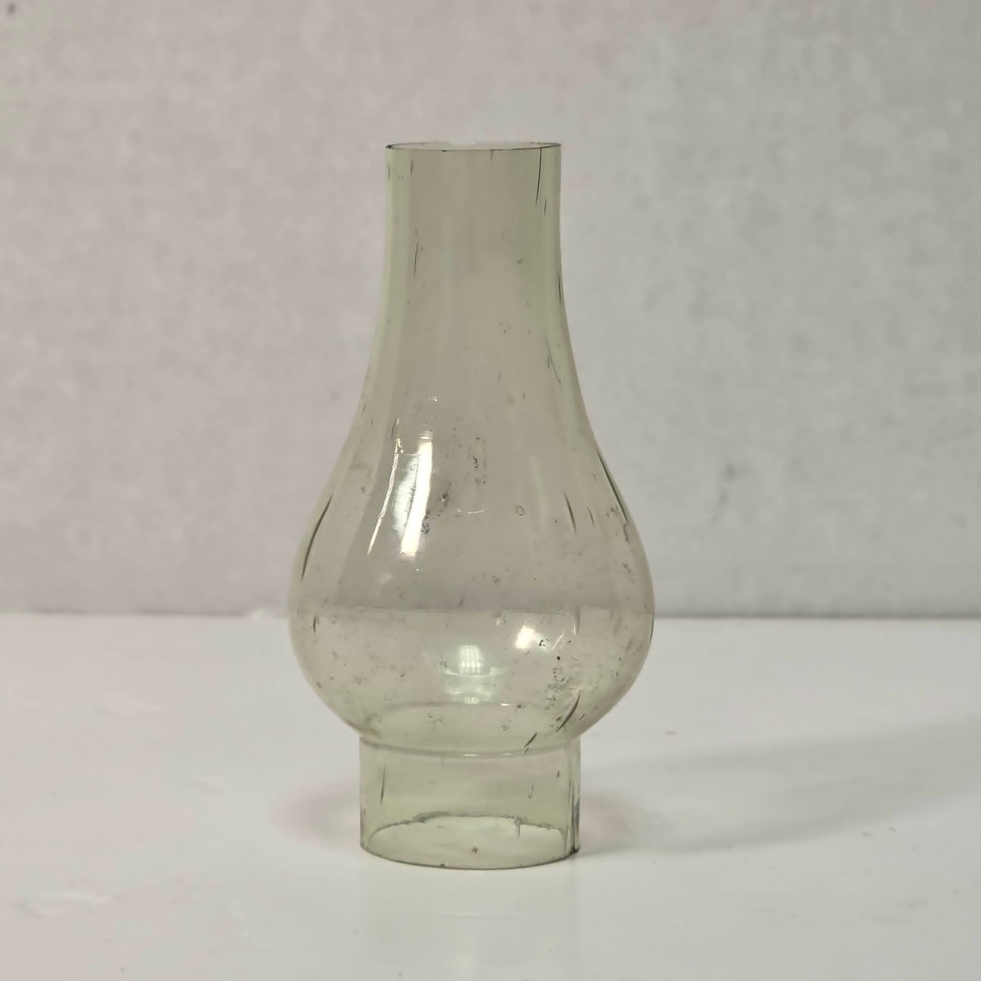 Antique miniature lamp chimney with primitive bubble glass inclusions.