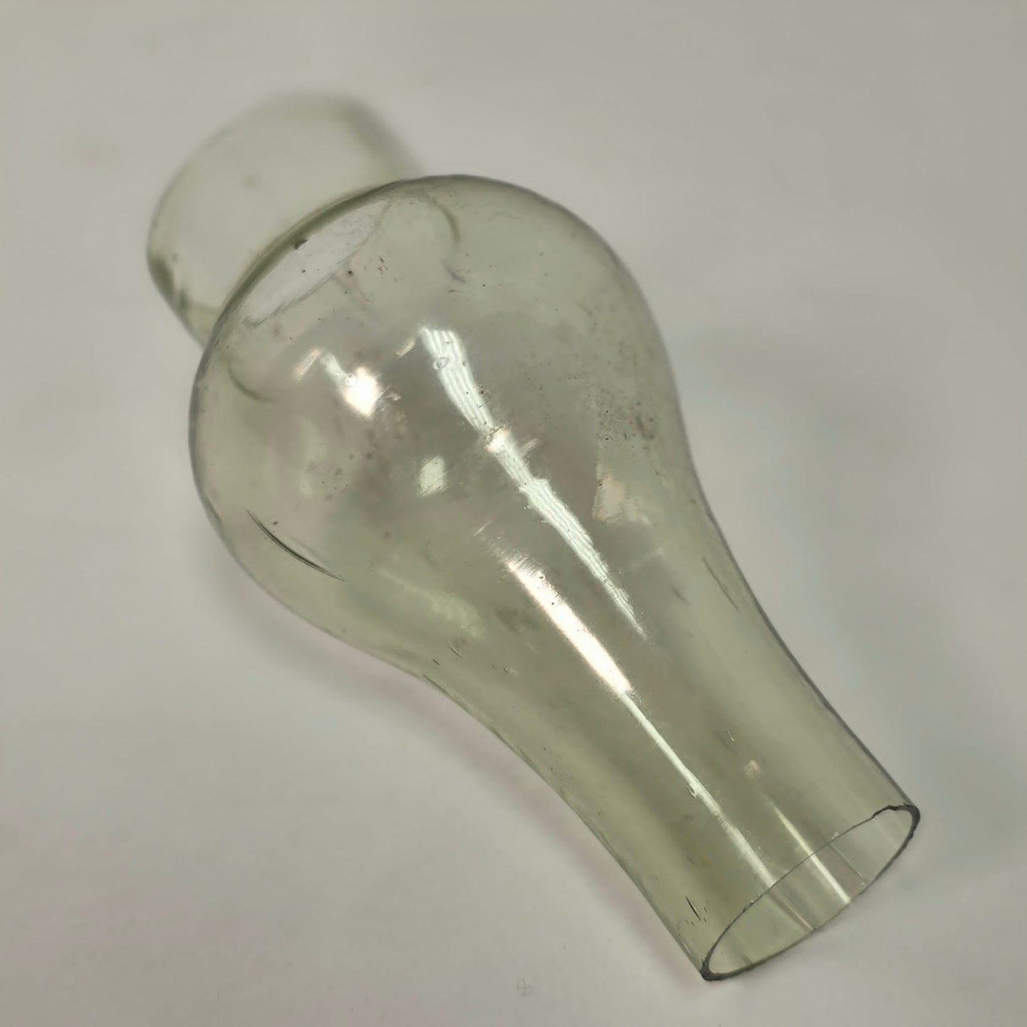 Antique miniature lamp chimney with primitive bubble glass inclusions.