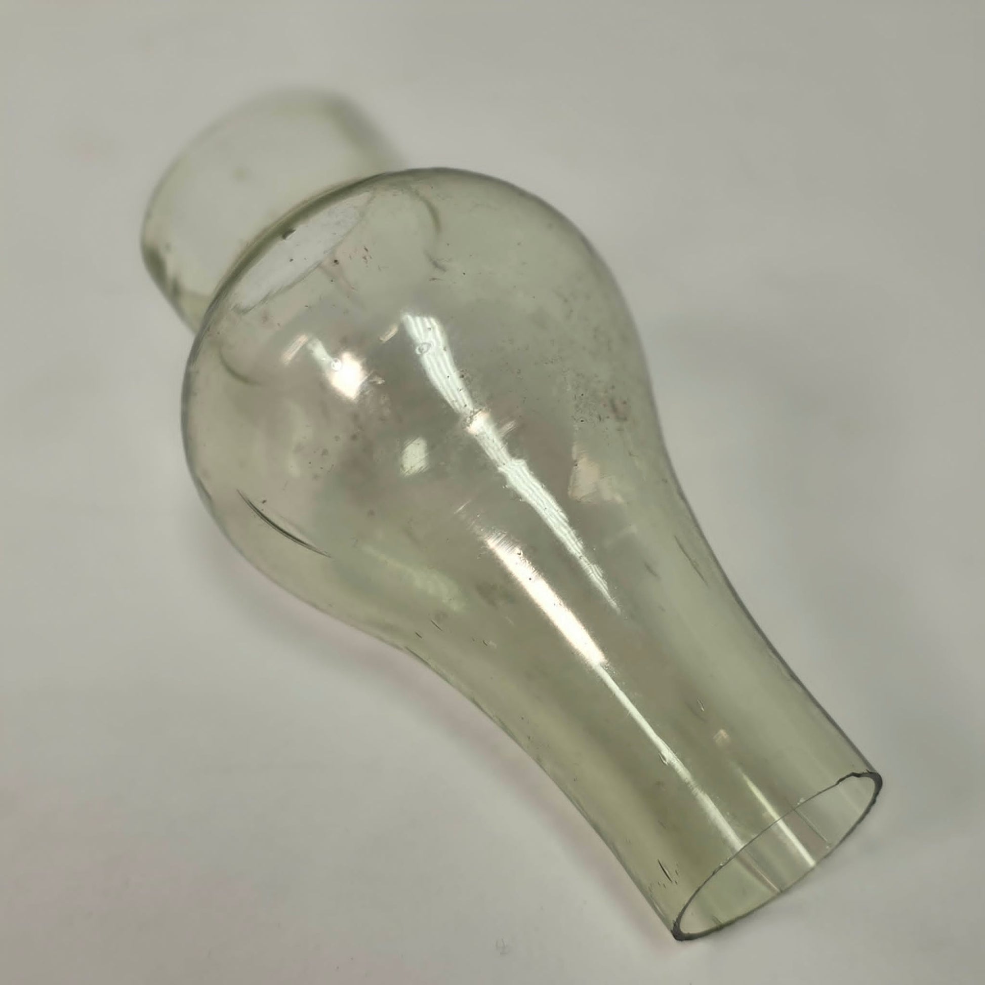 Antique miniature lamp chimney with primitive bubble glass inclusions.