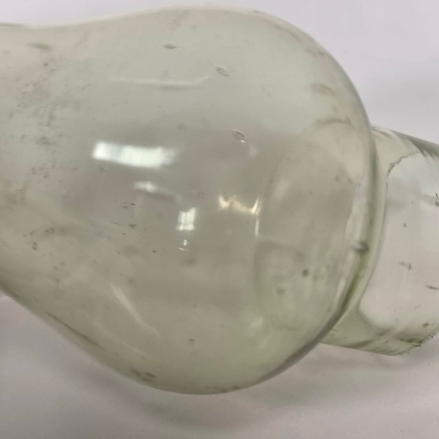 Antique miniature lamp chimney with primitive bubble glass inclusions.