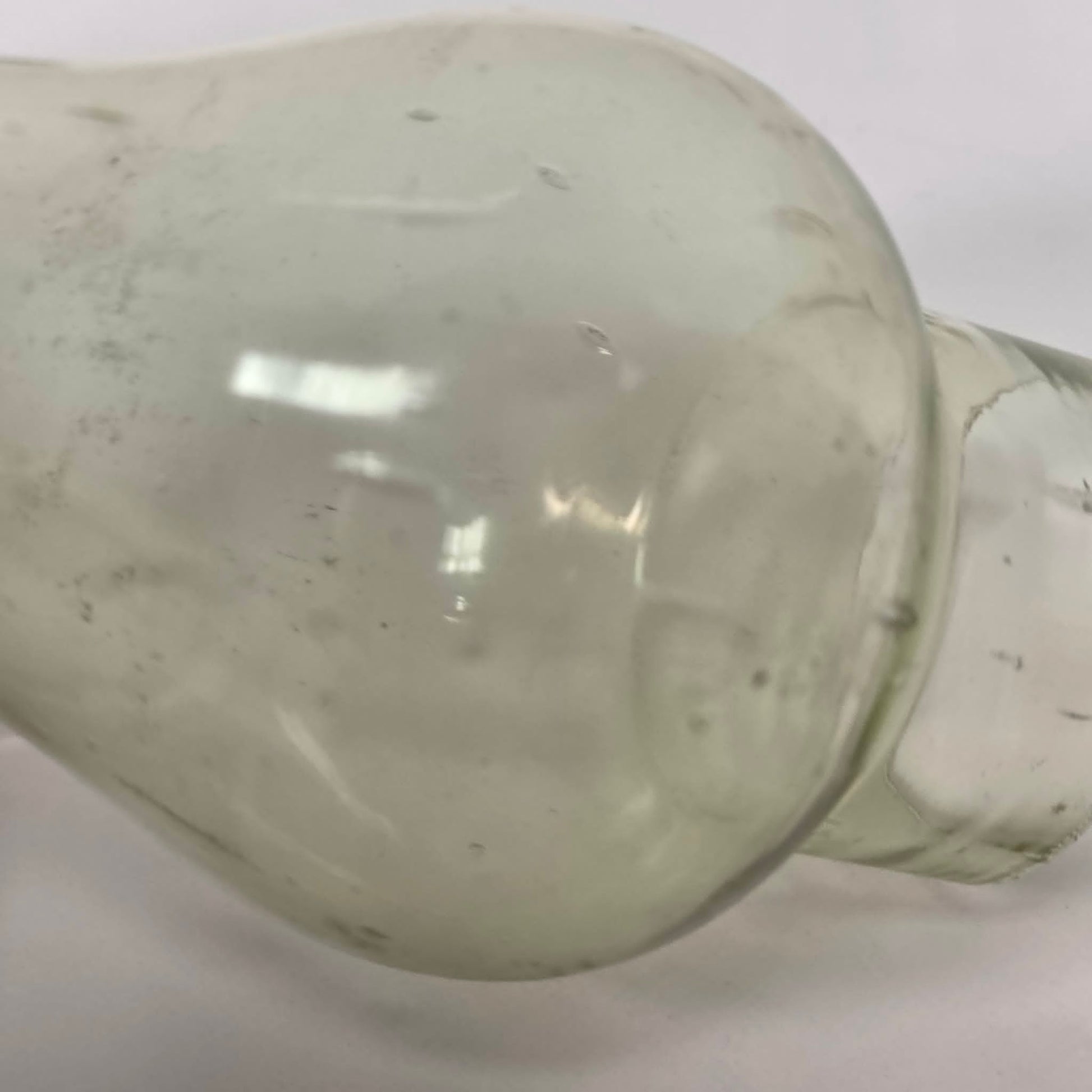 Antique miniature lamp chimney with primitive bubble glass inclusions.