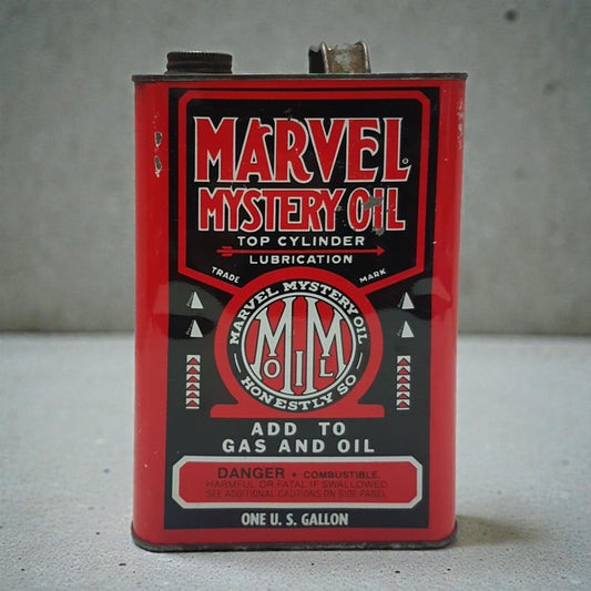 Vintage Marvel Mystery Oil can on a gray background