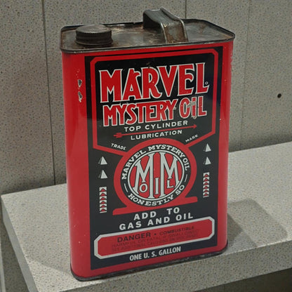 Vintage Marvel Mystery Oil can on a concrete surface