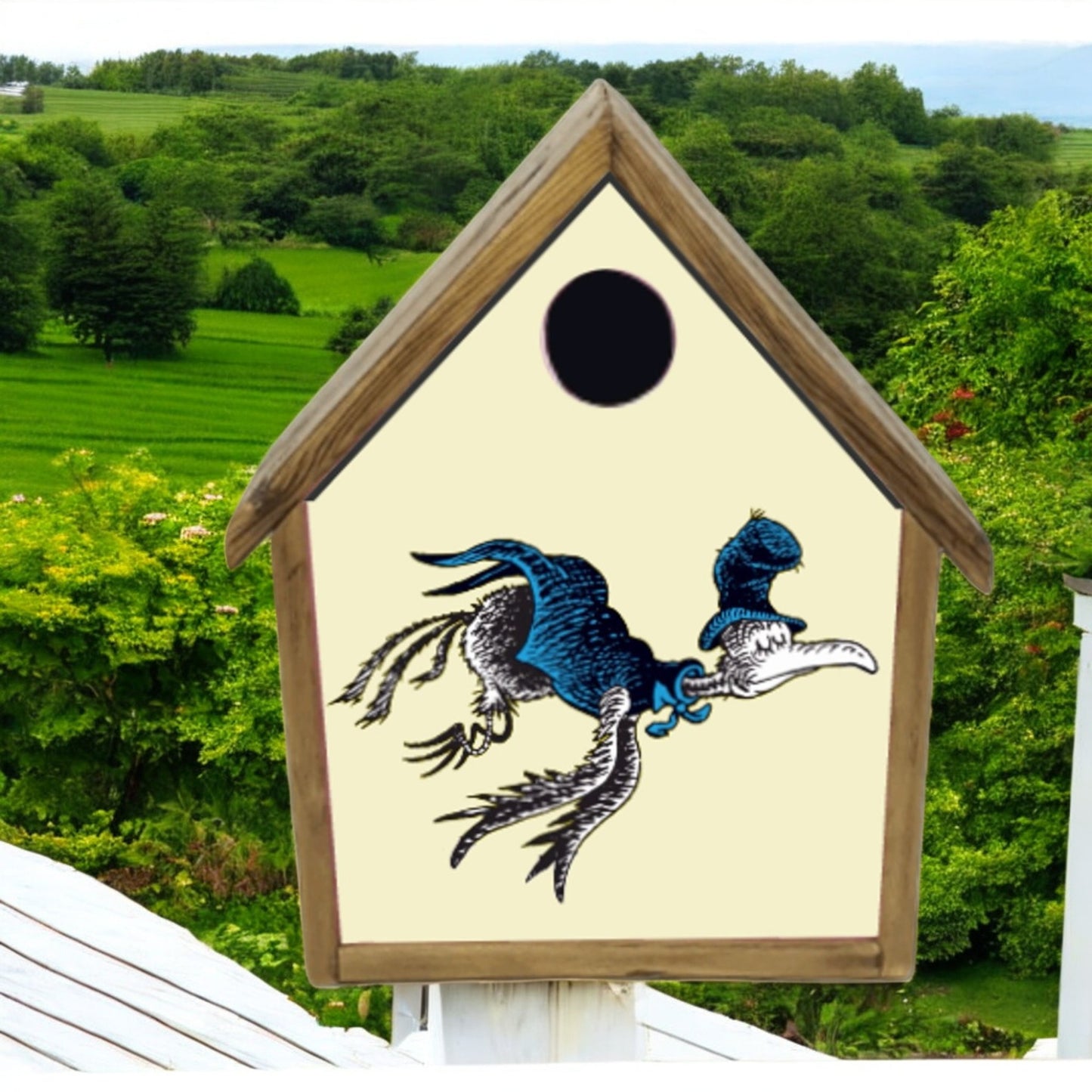 Birdhouse with a dragon design on a green landscape