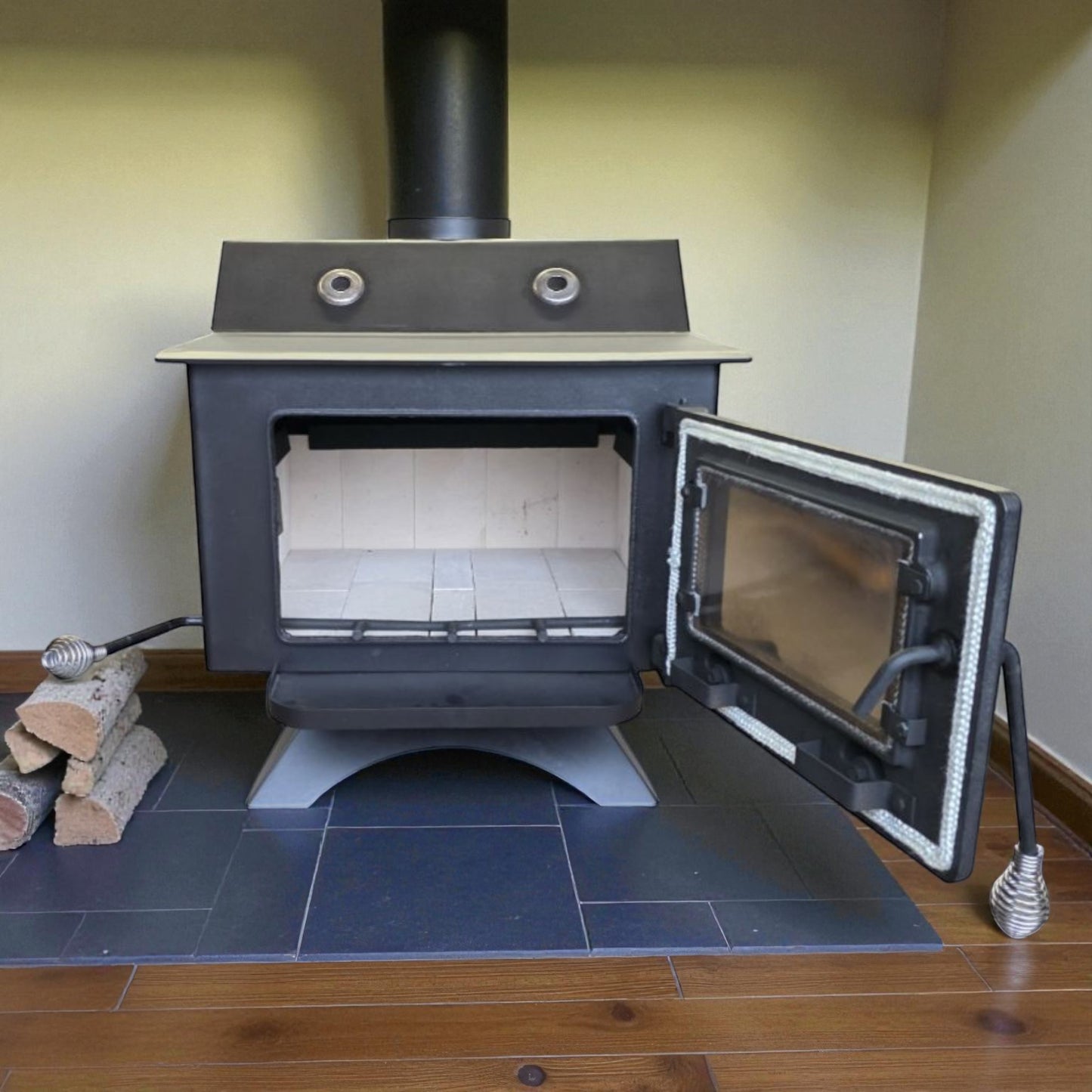 Wood-burning stove with open door on a tiled floor