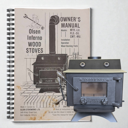 Olsen Inferno wood stove with owner's manual on a white background