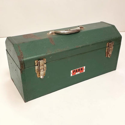 Green metal toolbox with 'PARK' label on a white background