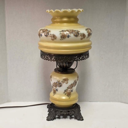 Vintage petite Gone with the Wind hurricane lamp with yellow floral decoration and tri-light feature.
