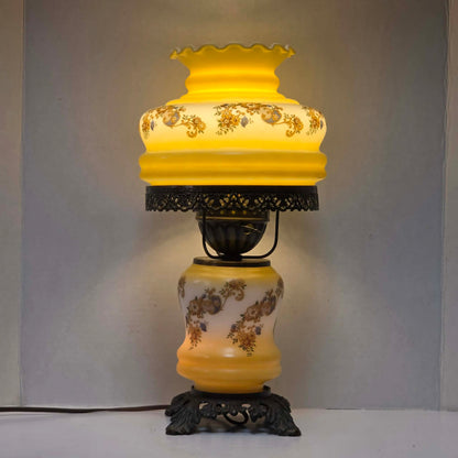 Vintage petite Gone with the Wind hurricane lamp with yellow floral decoration and tri-light feature.
