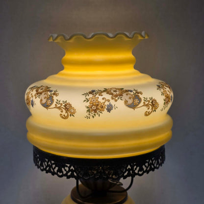 Vintage petite Gone with the Wind hurricane lamp with yellow floral decoration and tri-light feature.
