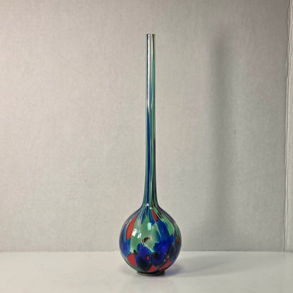 Colorful 14-inch hand-blown glass plant watering ball adding vibrant flair.