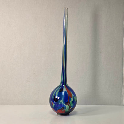 Colorful 14-inch hand-blown glass plant watering ball adding vibrant flair.