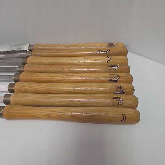 A rare signed set of eight Józef Gajka European woodturning chisels showcasing traditional Polish toolmaking craftsmanship.