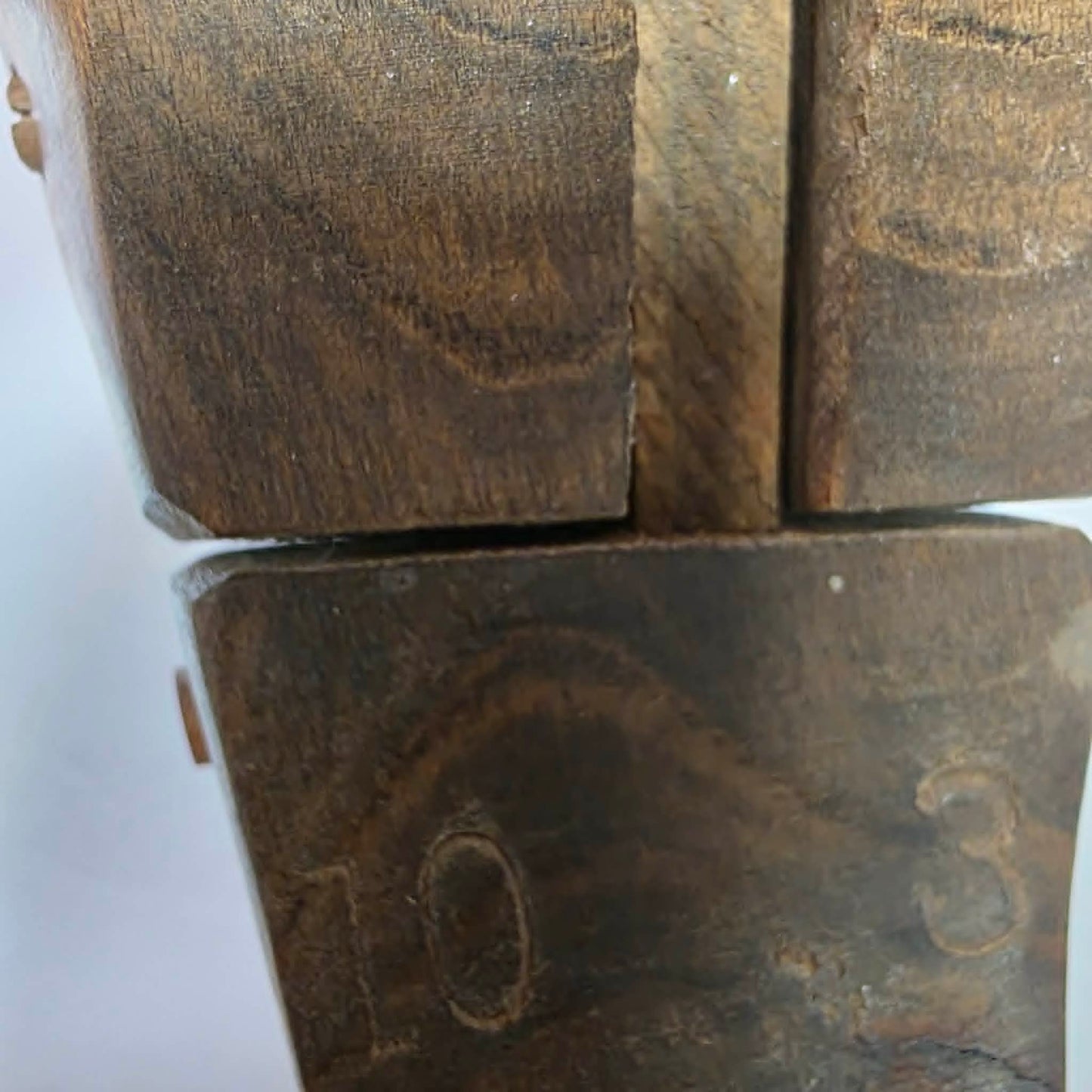 Pair of antique primitive wooden shoe stretchers with pegged construction and aged patina, early cobbler tools with articulated joint.