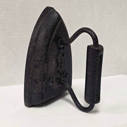 Antique cast iron tailor's press iron made in Guelph Ontario with beautifully formed handle.
