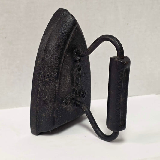 Antique cast iron tailor's press iron made in Guelph Ontario with beautifully formed handle.
