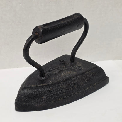 Antique cast iron tailor's press iron made in Guelph Ontario with beautifully formed handle.
