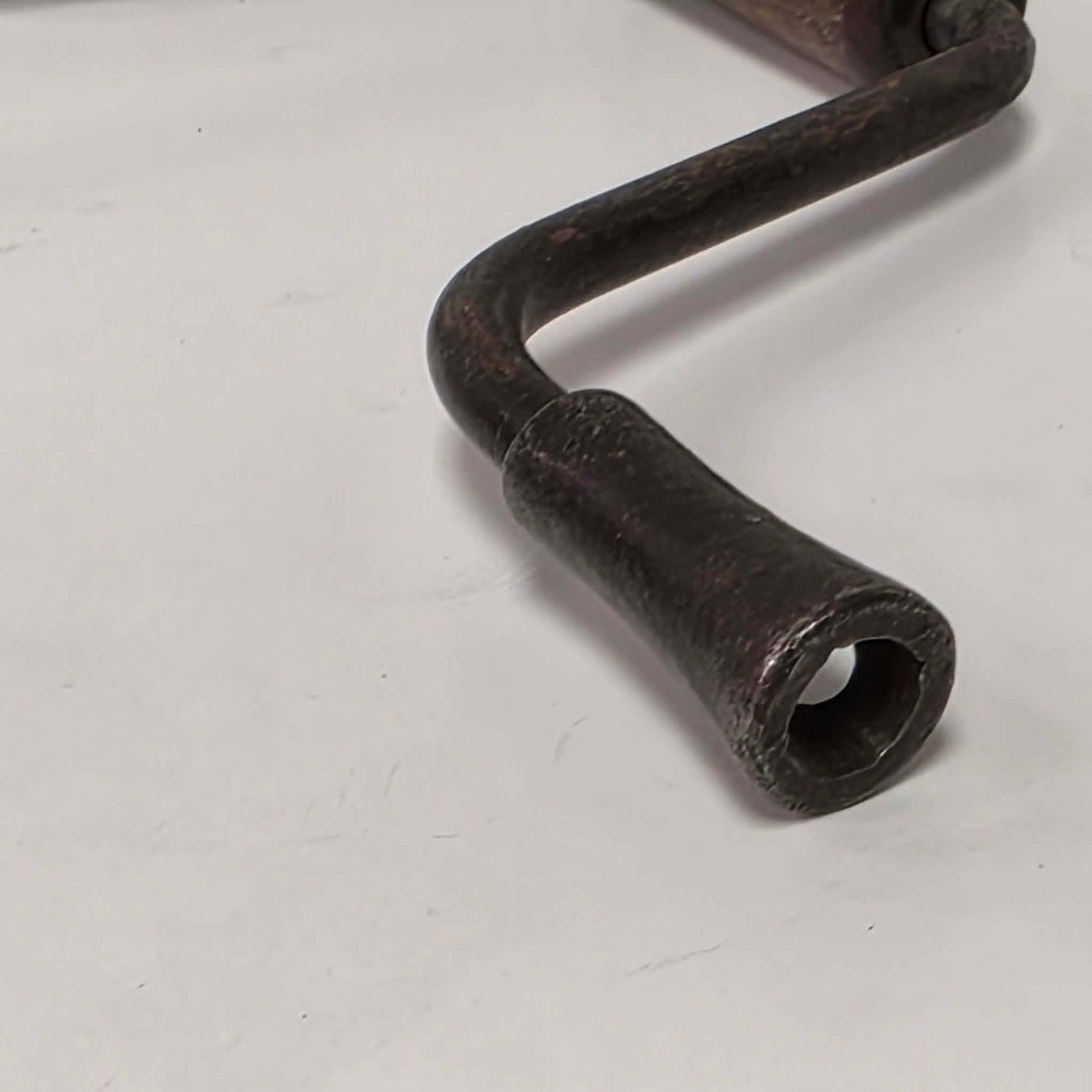 Antique petite hand-powered woodworking bit brace measuring 11 inches.
