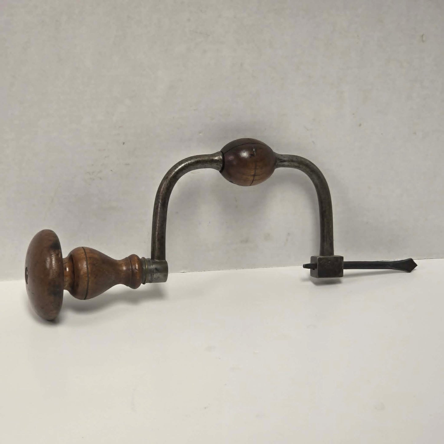 Antique J.G.B.N.S. walnut-handled bit brace with original drill bit.
