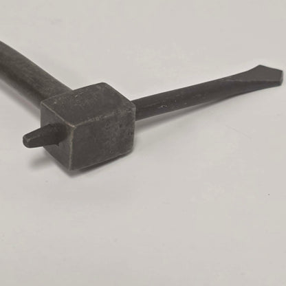 An exquisitely crafted antique walnut-handled bit brace that showcases the beauty and precision of early woodworking tools.
