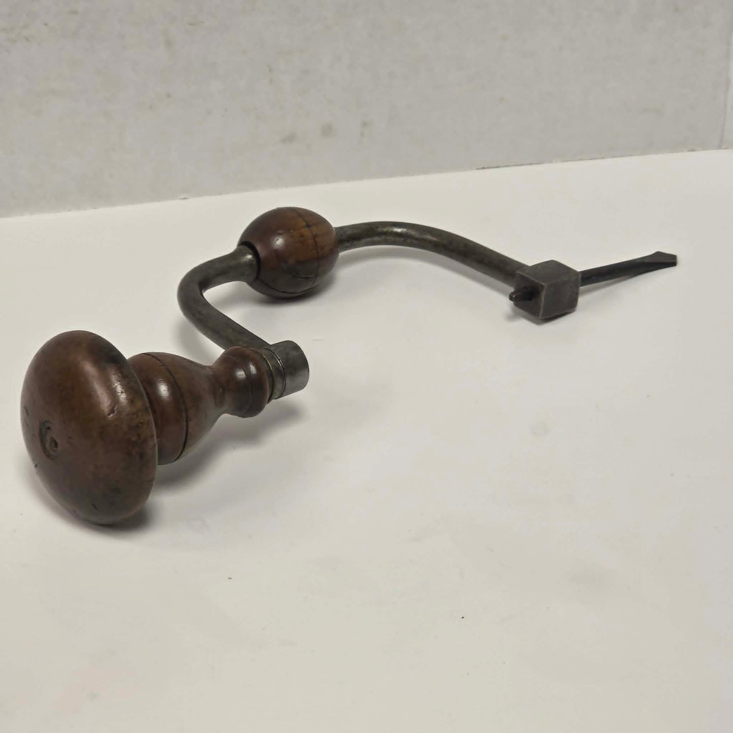 Antique J.G.B.N.S. walnut-handled bit brace with original drill bit.
