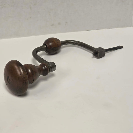 Antique J.G.B.N.S. walnut-handled bit brace with original drill bit.
