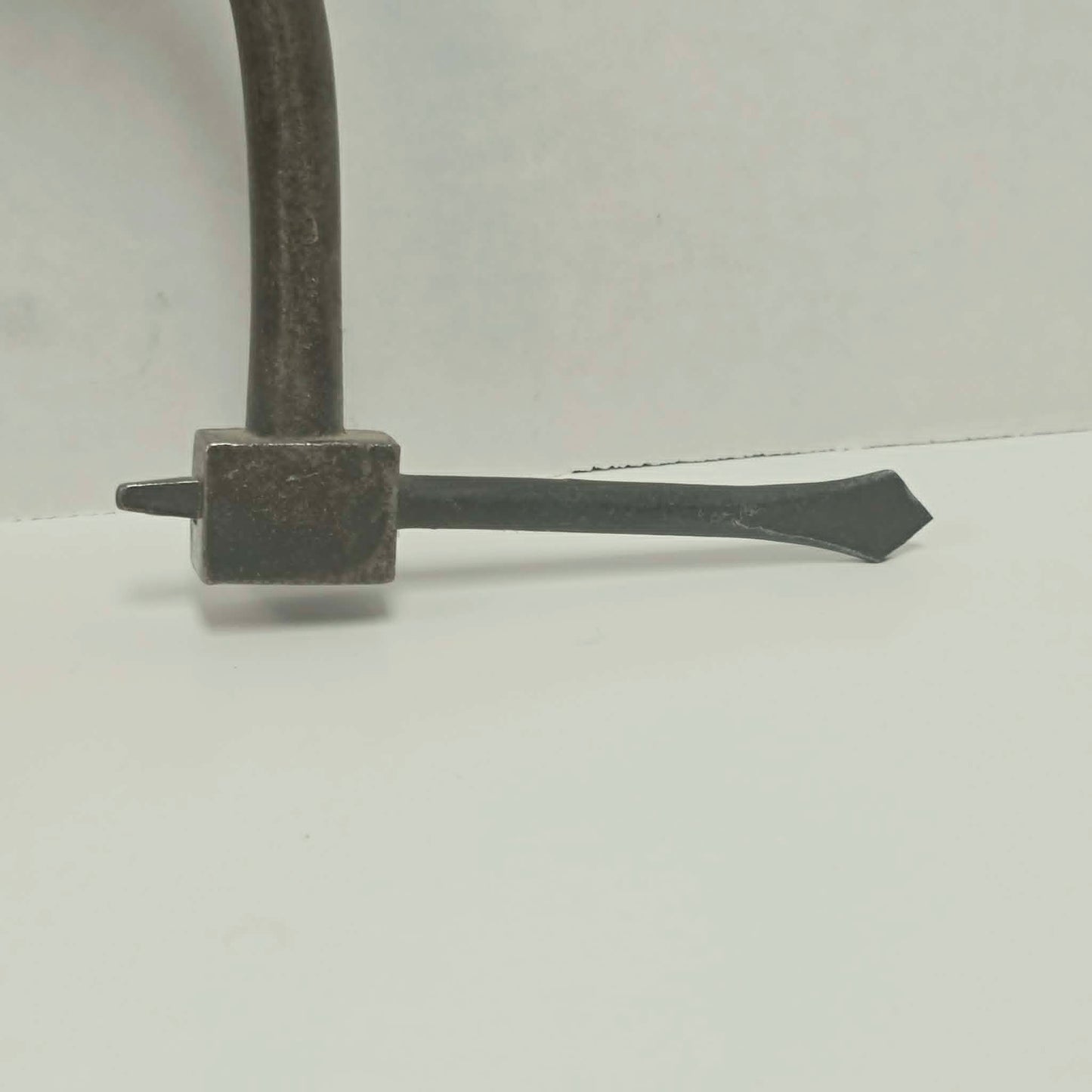 An exquisitely crafted antique walnut-handled bit brace that showcases the beauty and precision of early woodworking tools.
