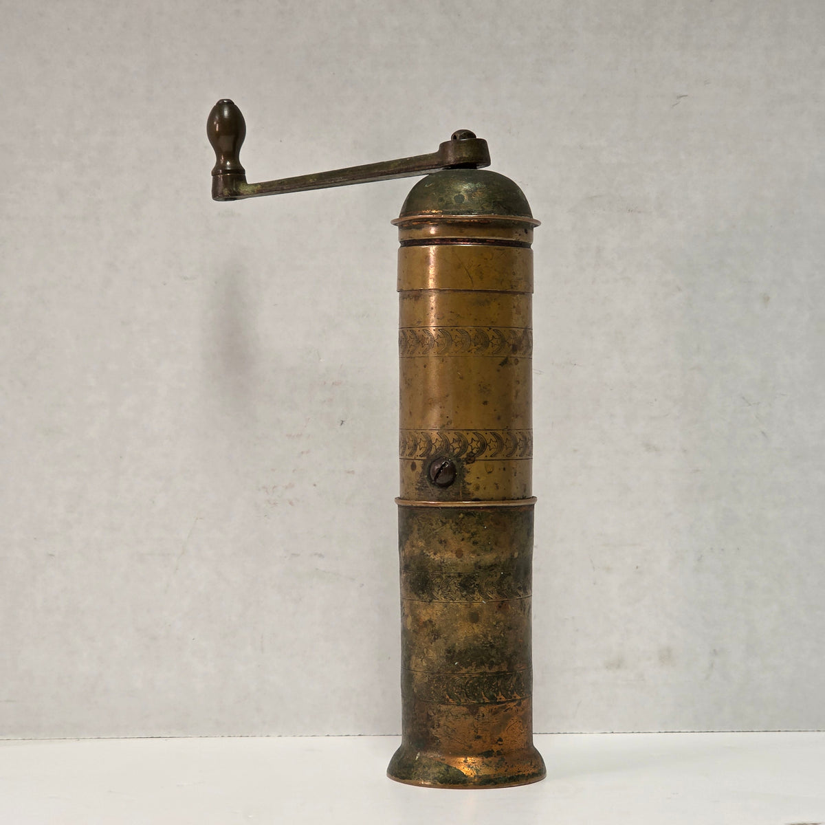 Nine-inch primitive antique hand-crank pepper grinder