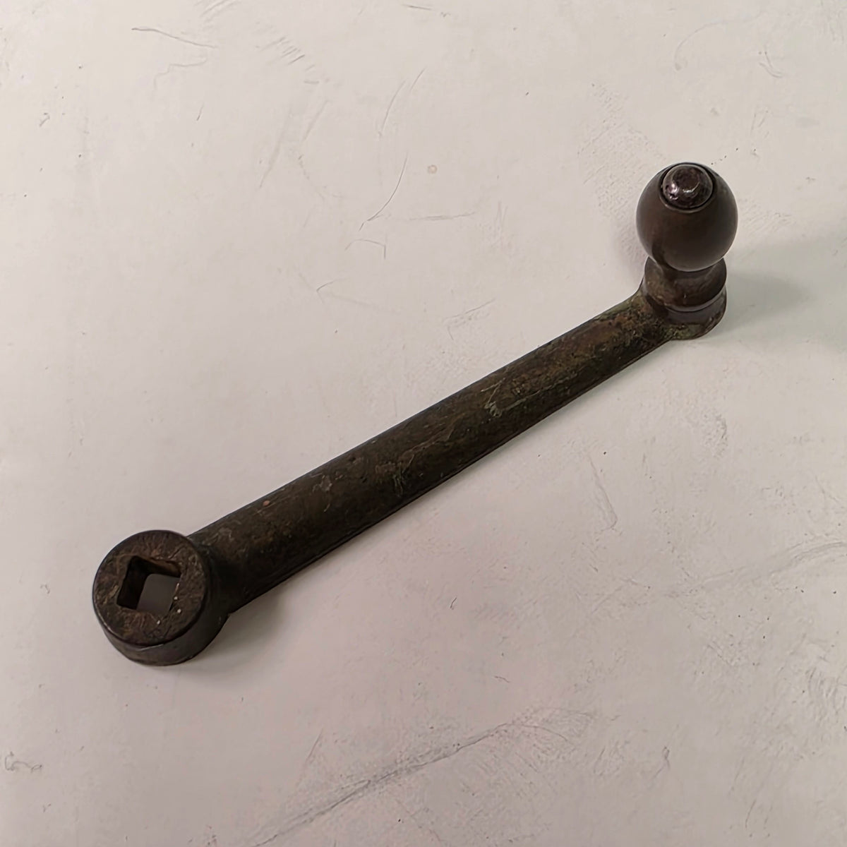 Nine-inch primitive antique hand-crank pepper grinder